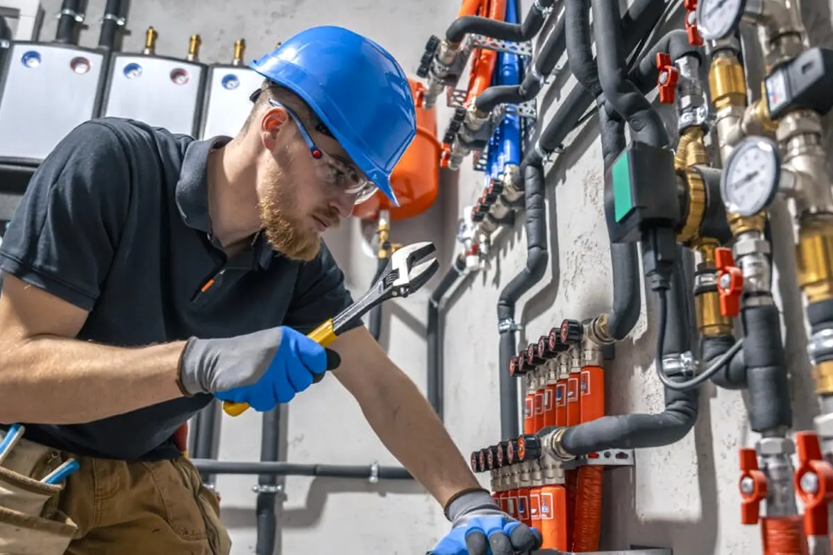 Electric Furnace Repair in Downtown Monterey Park Monterey Park CA — technician working on a residential furnace