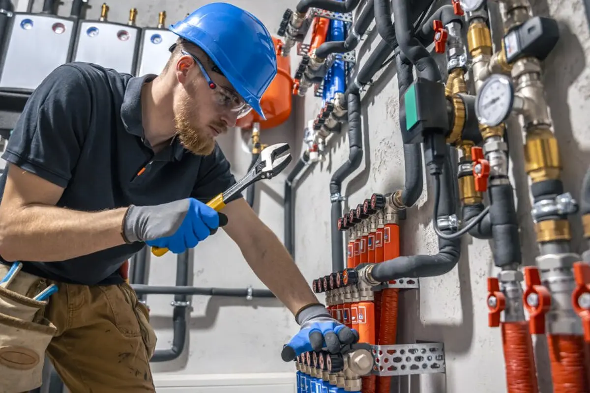 Electric Furnace Repair in Elder Park Monterey Park CA — technician working on a residential furnace
