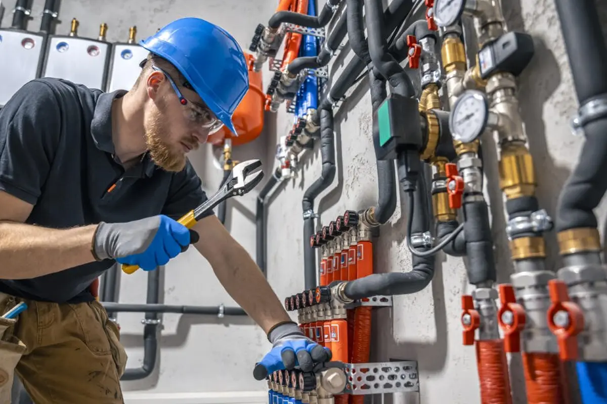 Electric Furnace Repair in Monterey Highlands Monterey Park CA — technician working on a residential furnace