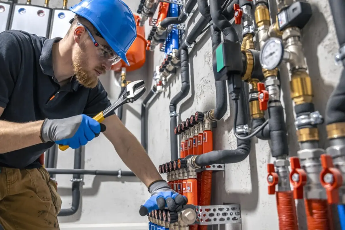 Furnace Blower Motor Repair in Midwick Monterey Park CA — technician working on a residential furnace