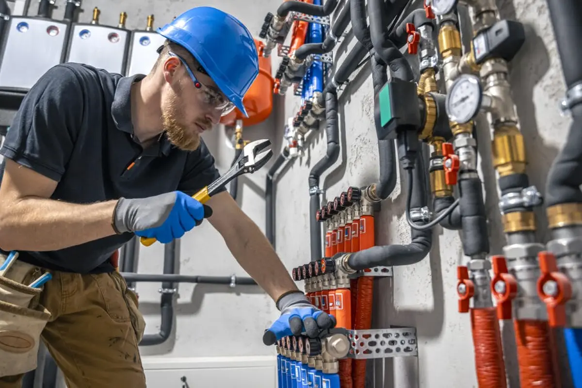 Furnace Igniter Replacement in Sequoia Monterey Park CA — technician working on a residential furnace