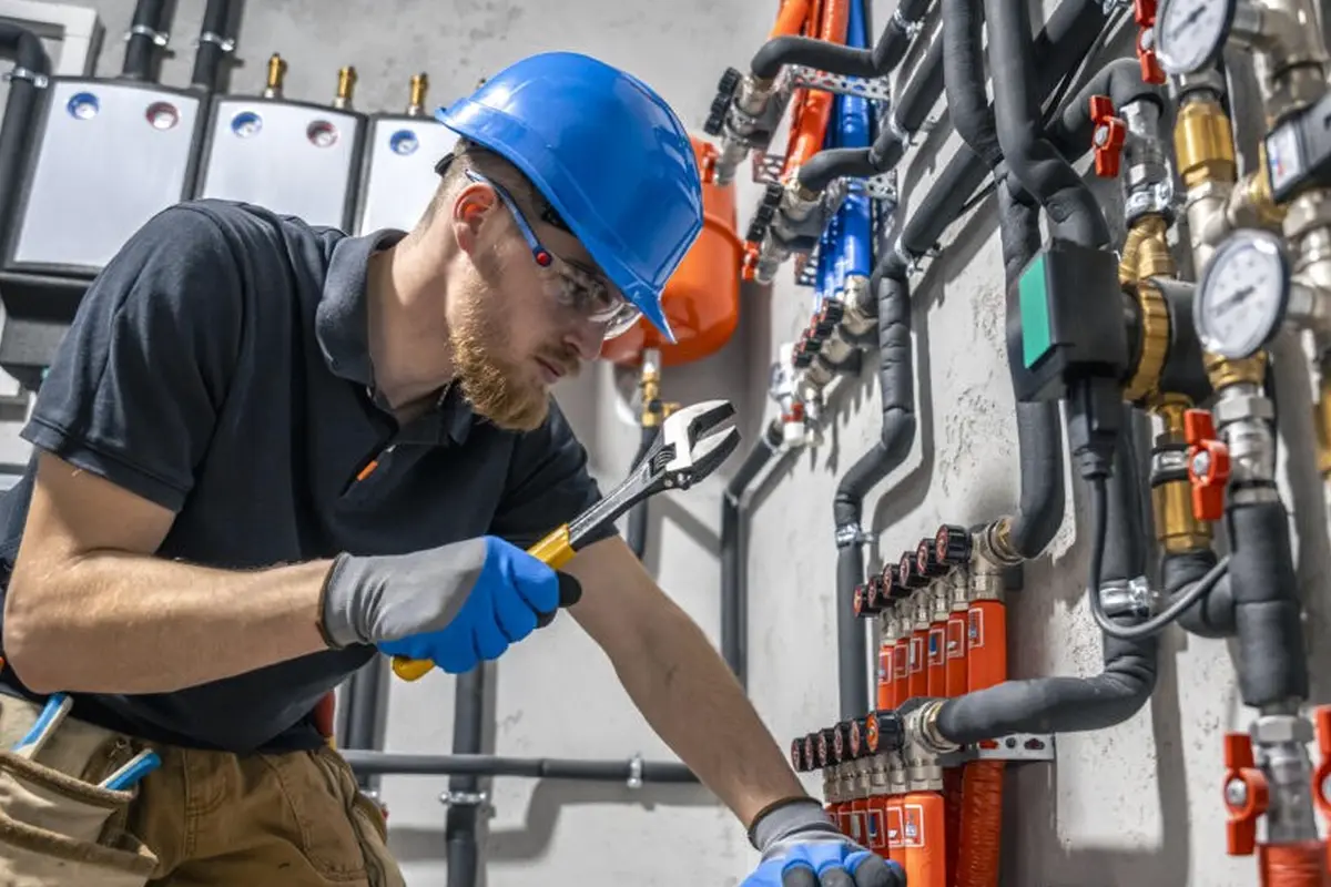 Furnace Installation & Replacement in Garvey Ranch Monterey Park CA — technician working on a residential furnace