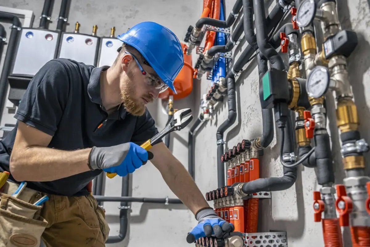 Furnace Maintenance & Tune-Up in Barnes Park Monterey Park CA — technician working on a residential furnace