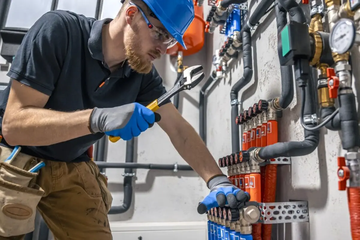 Furnace Maintenance & Tune-Up in Garvey Ranch Monterey Park CA — technician working on a residential furnace