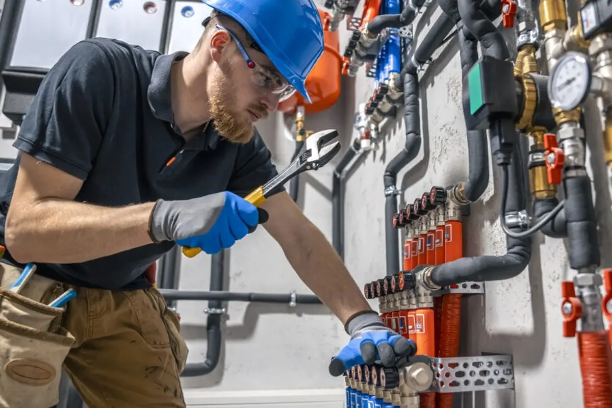 Thermostat Repair & Replacement in North Monterey Park Monterey Park CA — technician working on a residential furnace