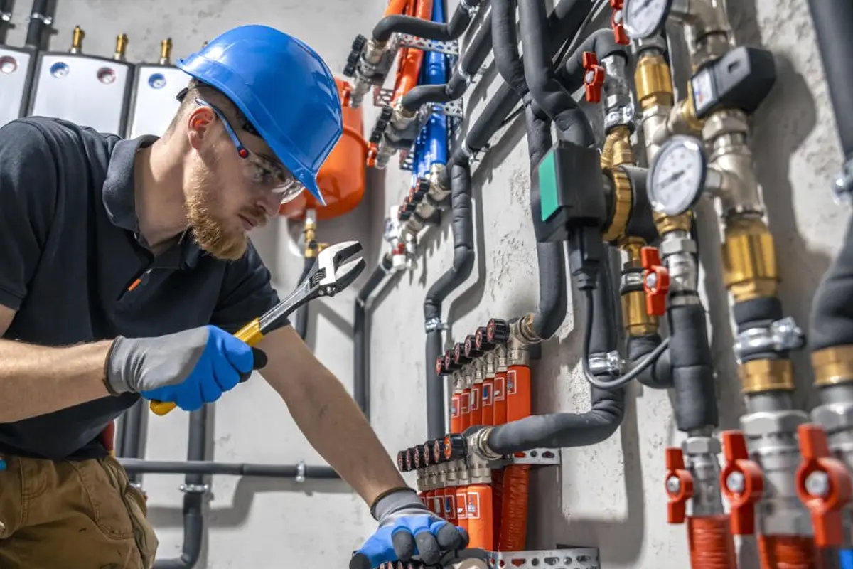 Wall Furnace Repair in Barnes Park Monterey Park CA — technician working on a residential furnace