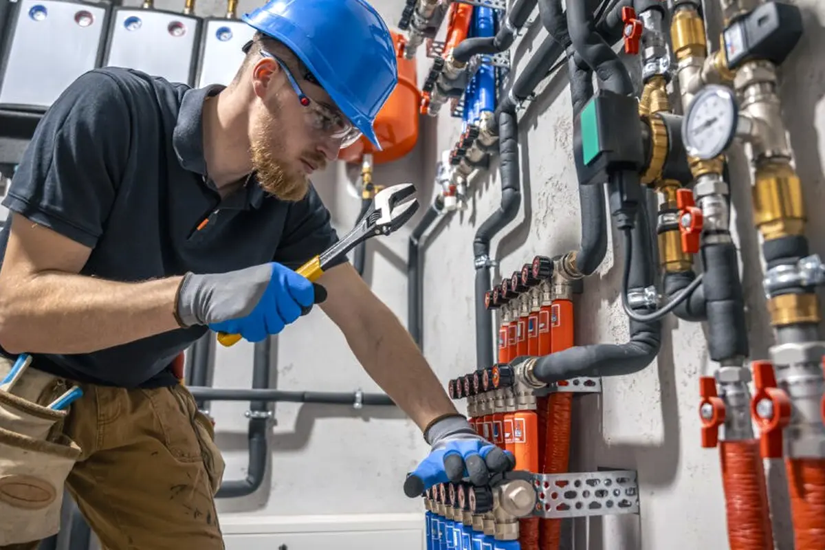 Wall Furnace Repair in Monterey Highlands Monterey Park CA — technician working on a residential furnace